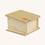 A side view of the Beck Holzspielzeug Wooden Small Toy Car Garage showing the side and back of the garage. This wooden toy car garage is part of a wide range of toy vehicles and accessories available at Babipur.