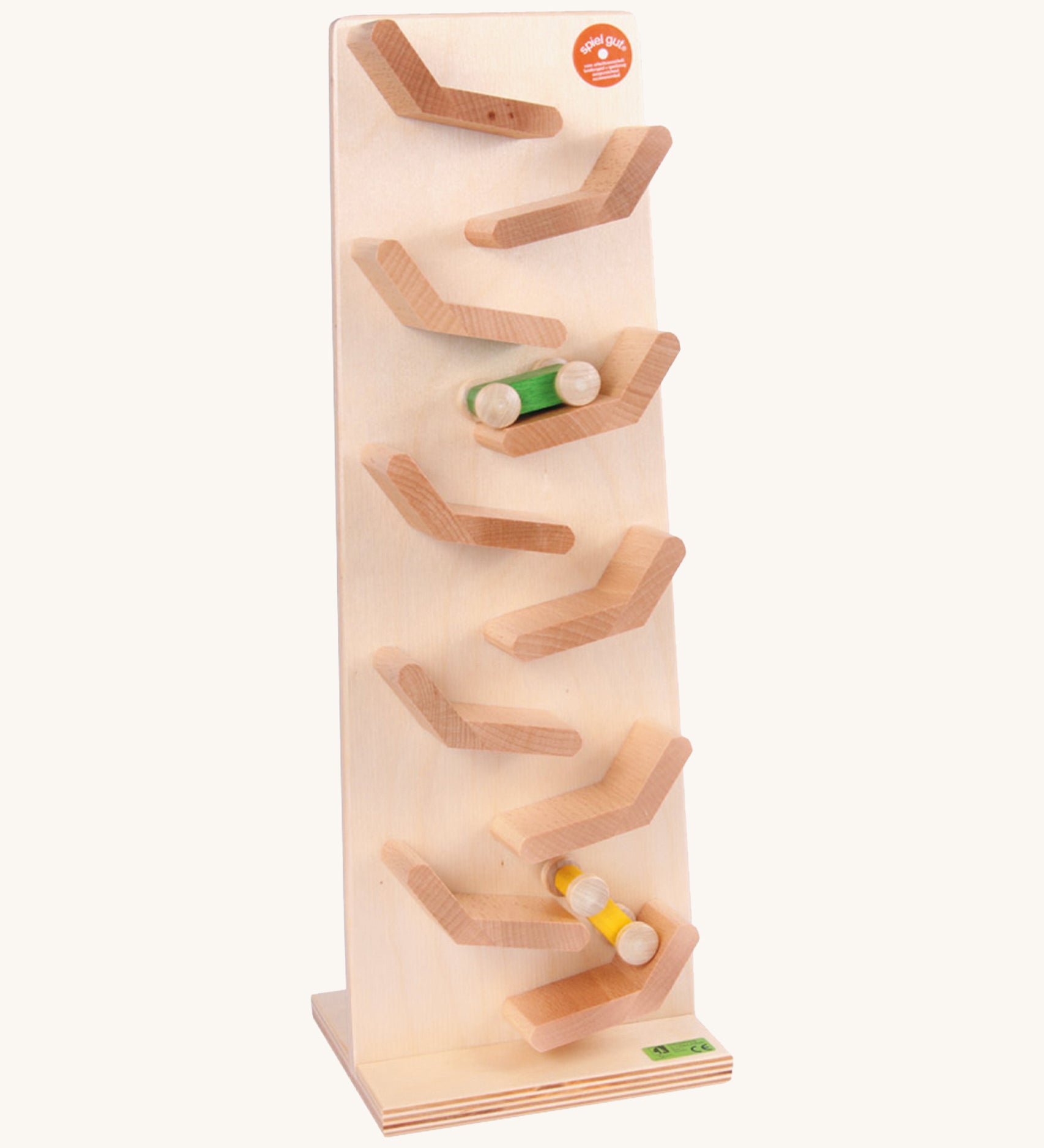 Beck Toys wooden cascading tower run for cars. Showing a tilted plank with a green and yellow car running down