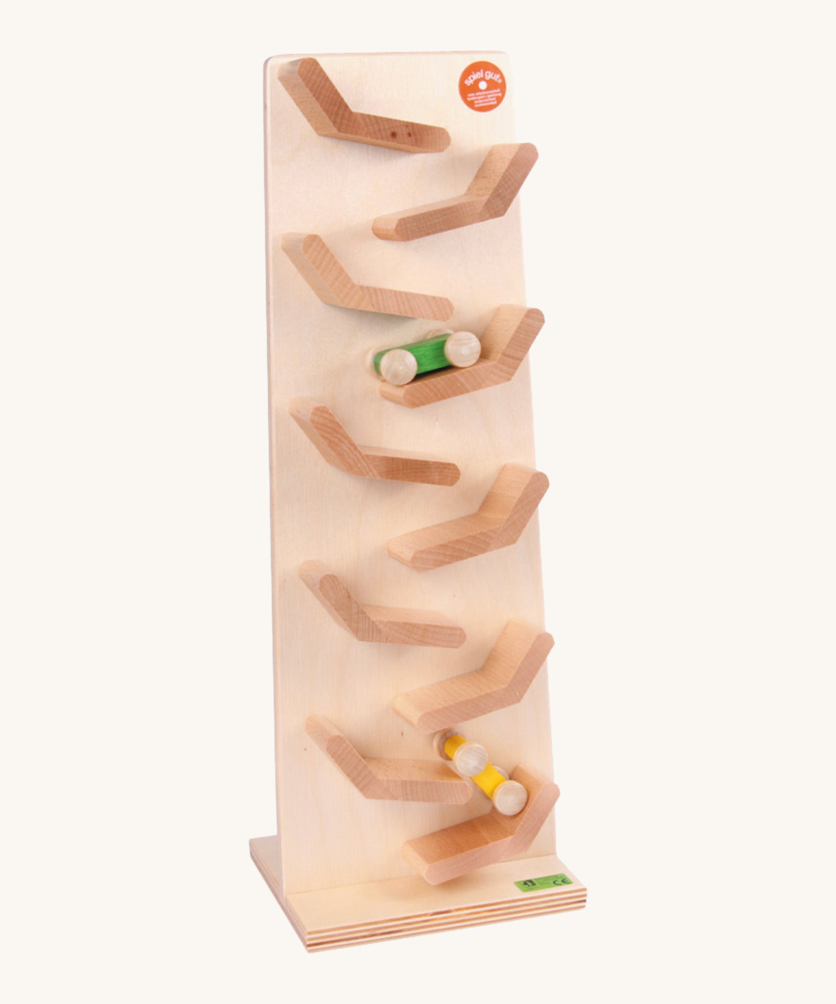 Beck Toys wooden cascading tower run for cars. Showing a tilted plank with a green and yellow car running down