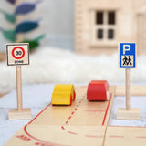 A Beck wooden speed limit and parking sign standing near a road set with vehicles on top 