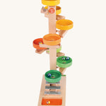 Beck Toys wooden tower marble run. Made from beech wood showing a series of coloured plates and a glockenspiel on the bottom. 