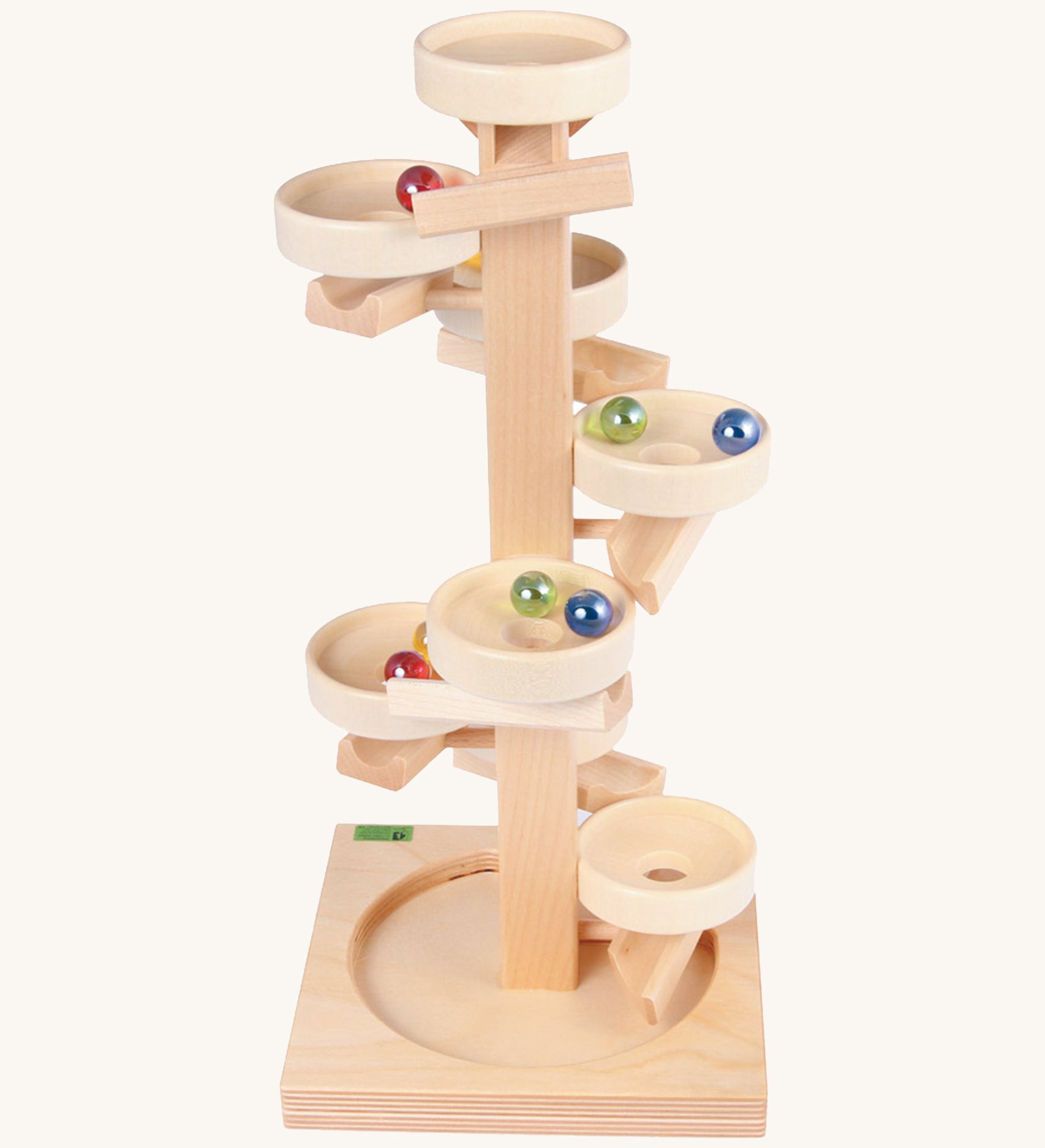 Beck Toys wooden tower marble run. Made from beech wood showing a series of plates along the stand and marbles travelling down