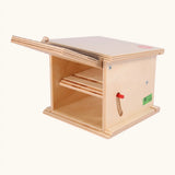 Beck wooden double garage toy showing a 2 tier garage with a lid door and red side lever