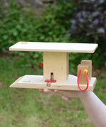 Beck wooden garage & petrol station in a child's hand.
