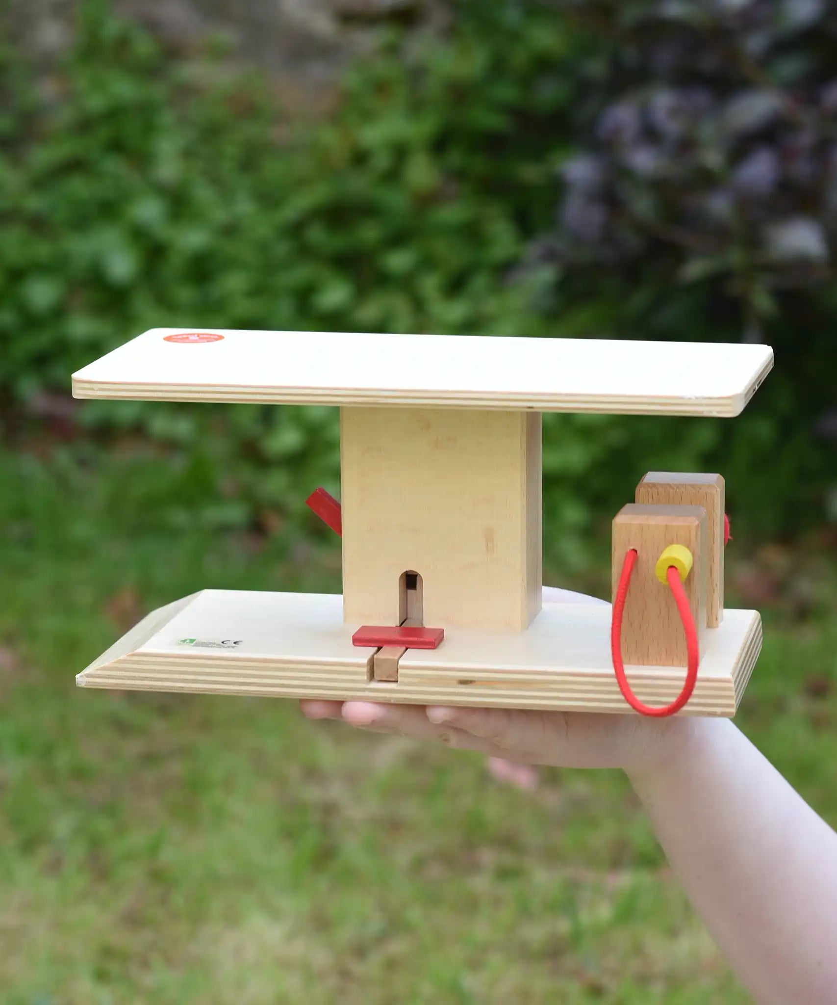 Beck wooden garage & petrol station in a child's hand.