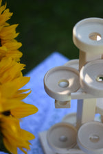 A close up of the circular wooden plated on the Beck Marble Run Plate Tower.