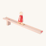 Beck Toys wooden nurmi walker ramp showing a red doll walking on the ramp
