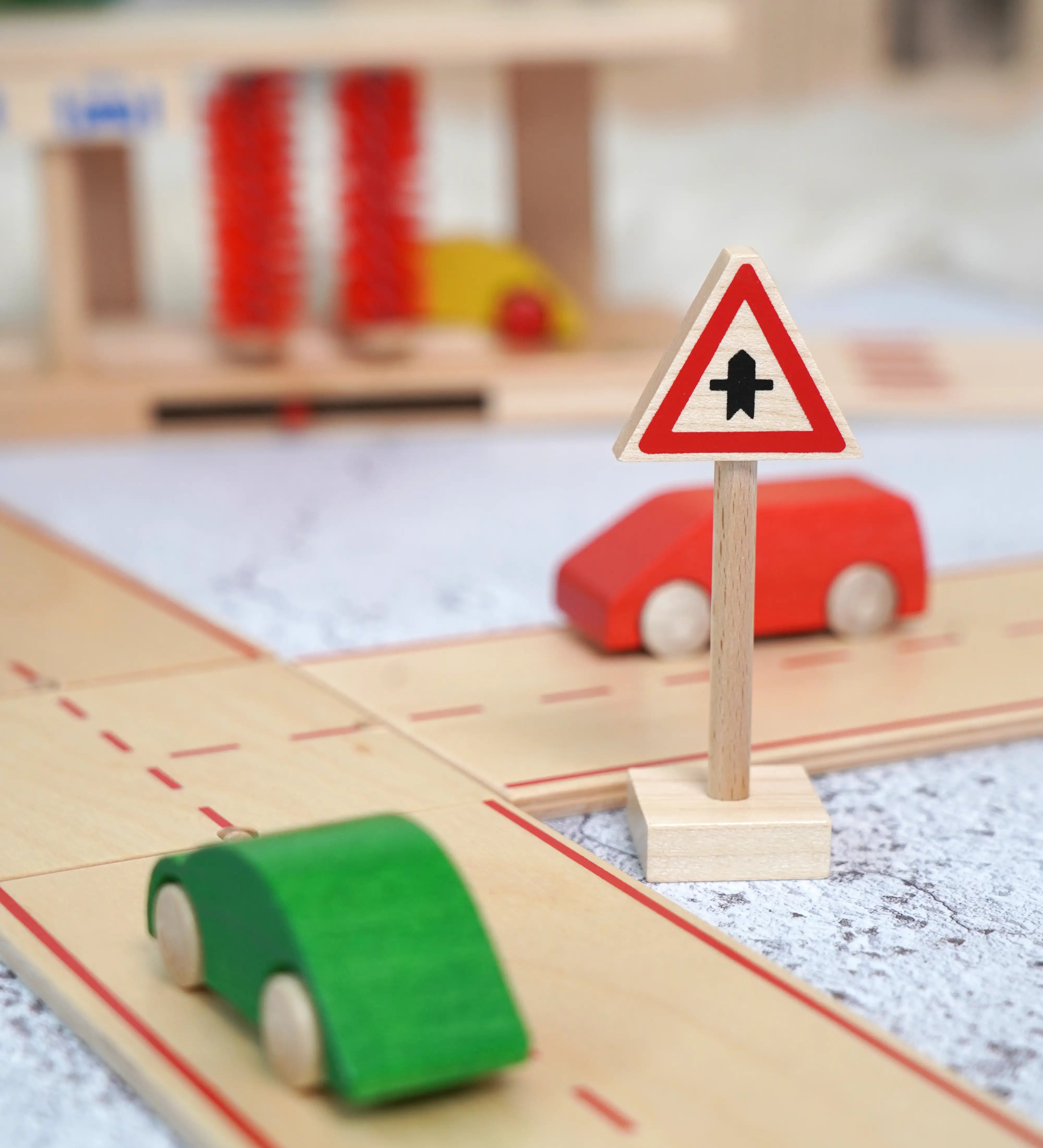 A Beck wooden junction traffic sign standing near a road set with vehicles on top 