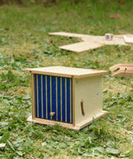 Beck wooden double garage toy placed on grass outdoors.