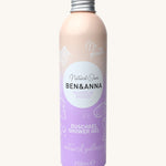 Ben and Anna shower gel in magnolia breeze fragrance showing the playful design on a lilac and peach gradient aluminium bottle   