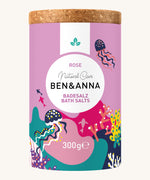 Ben & Anna rose bath salts showing the cork packaging with a playful pinkunder the sea design wrapped around the tub.