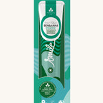 Ben & Anna spearmint toothpaste showing a green stripes and waves on the packaging with a playful smile slogan in white in the middle