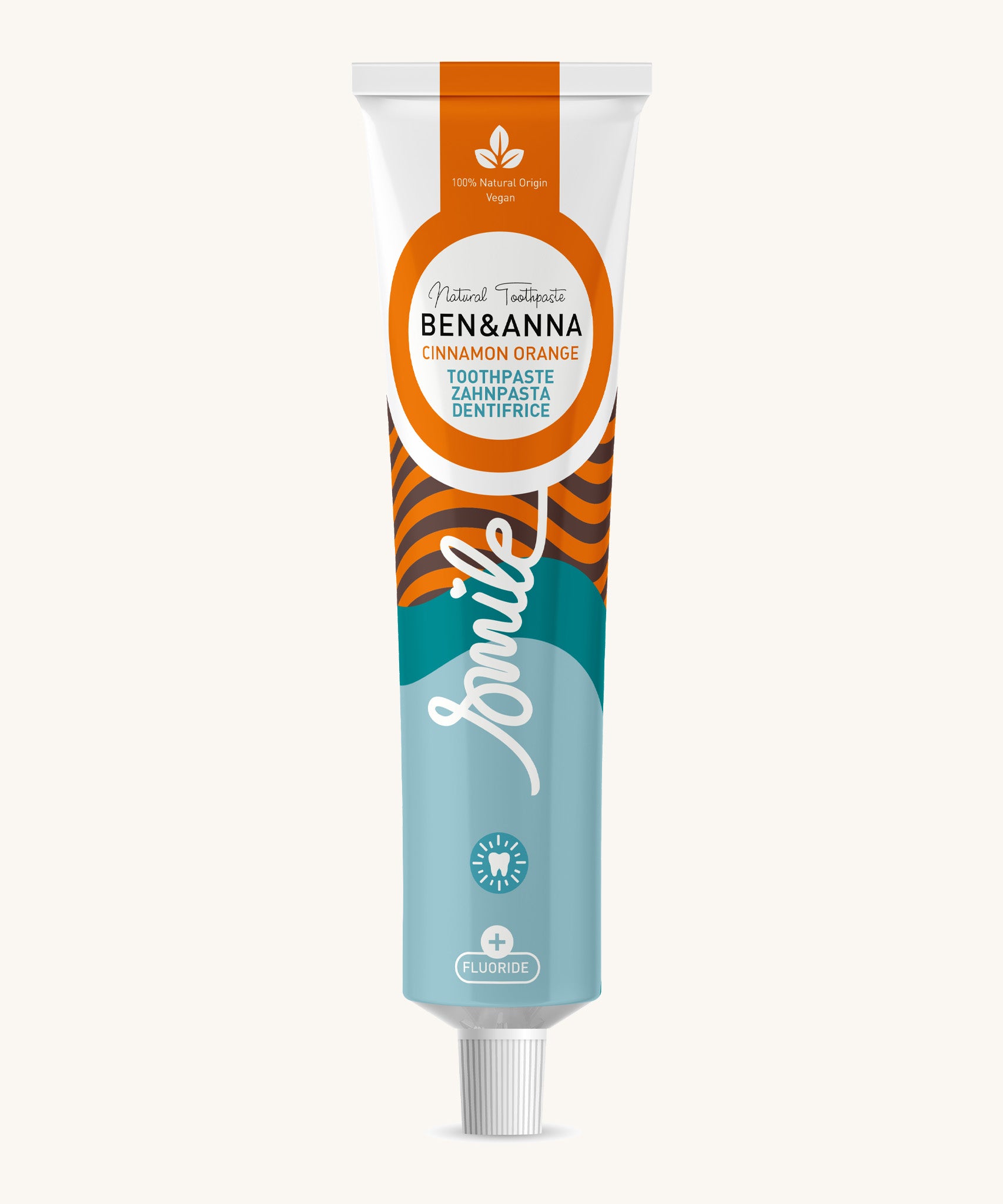 Ben & Anna certified 100% natural toothpaste in orange and cinnamon flavour showing a orange stripes with blue waves design on the tube. Features a playful smile slogan in white in the middle.