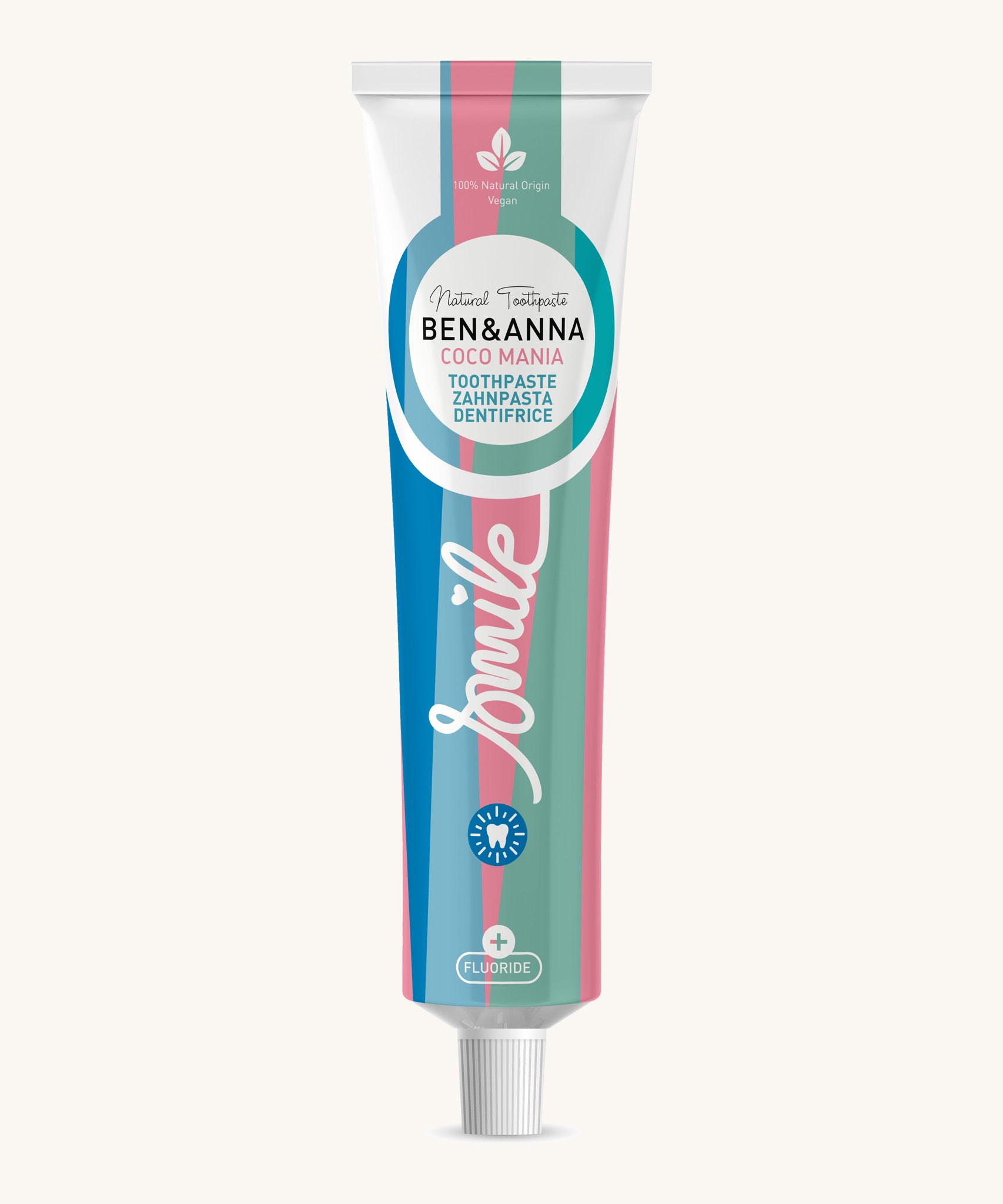 Ben & Anna certified 100% natural toothpaste in coco mania. Showing a blue, pink and green striped design on the tube. Features a playful smile slogan in white in the middle.
