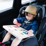 Child in a baby car seat wearing a brown hat