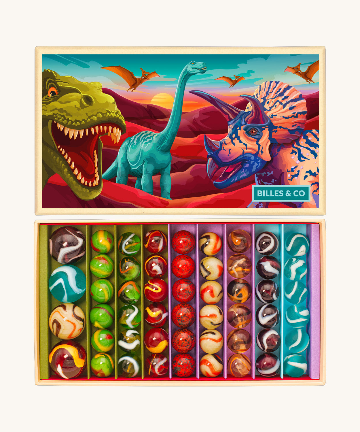 The Billes & Co large collectible glass marbles box, with a dinosaur theme. The box is open to show the different types and colours of glass marbles, next to the lid that is illustrated with colourful dinosaurs.