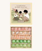 Billes & Co marbles and Babyatoutprix collaboration set. Features 30 pastel coloured glass marbles including green pink and white with a mix of textured marbles. Comes in a artistic  box showing 3 people playing marbles on a field with a castle in the background.