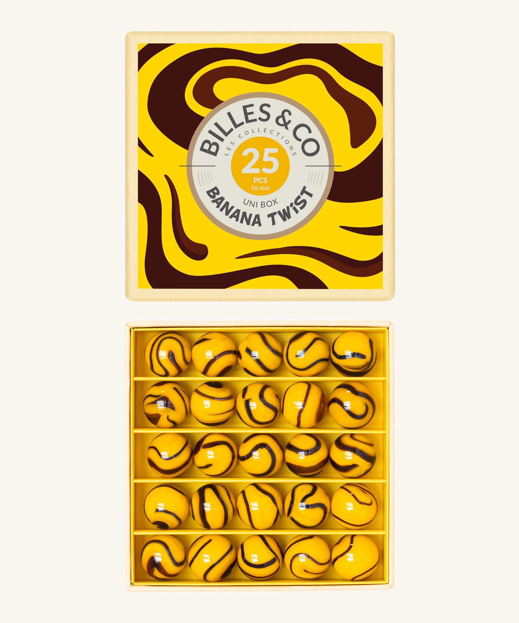 Billes & Co marbles in a banana twist design. Features 25 yellow and brown glass marbles and a matching decorative box. 