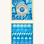 Billes & Co marbles in a orange wave inspired design. Features 29 blue and white glass marbles with a mixture of textured and flat marbles. Comes in a matching decorative box. 