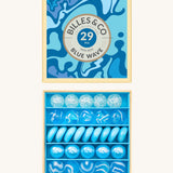 Billes & Co marbles in a orange wave inspired design. Features 29 blue and white glass marbles with a mixture of textured and flat marbles. Comes in a matching decorative box. 