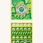 Billes & Co marbles in a orange wave inspired design. Features 29 green and white glass marbles with a mixture of textured and flat marbles. Comes in a matching decorative box. 