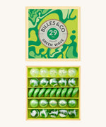 Billes & Co marbles in a orange wave inspired design. Features 29 green and white glass marbles with a mixture of textured and flat marbles. Comes in a matching decorative box. 