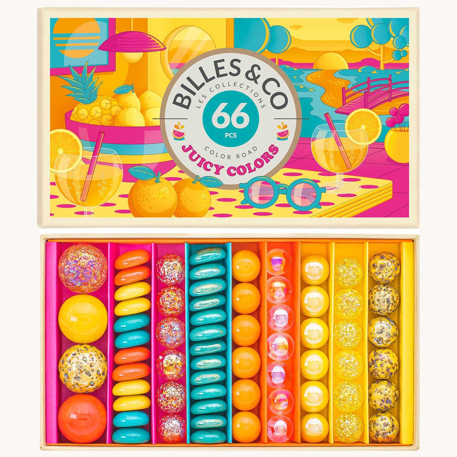 Billes & Co Juicy Colours Glass Marbles in various colours of blue, pink, yellow and frosted glass marbles inside their box, on a cream back ground