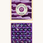 Billes & Co marbles in a manoir inpsired design. Features 25 purple and blue glass marbles and a matching spooky themed box. 