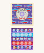 Billes & Co marbles in a neon fish inspired design. Features 25 pearlescent marbles with a mixture of glow in the dark glass marbles and a box with neon fish