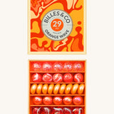 Billes & Co marbles in a orange wave inspired design. Features 29 orange and white glass marbles with a mixture of textured and flat marbles. Comes in a matching decorative box. 