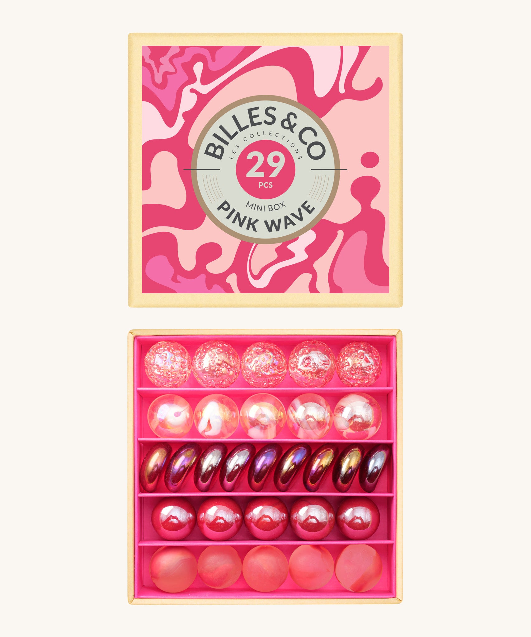 Billes & Co marbles in a pink wave inspired design. Features 29 pink glass marbles with a mixture of textured and flat marbles. Comes in a matching decorative box. 