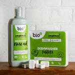 Box of Bio D eco friendly dishwasher tablets and bottle of Bio-D rinse aid on a green background