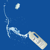 A 1L bottle of Bio-D cotton fresh fabric conditioner laying flat with the liquid spilling out the bottle. This fabric conditioner is available at Babipur.