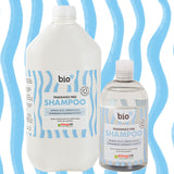Bio-D fragrance-free shampoo shown in 5 litre refill bottle alongside reusable 500ml bottle, emphasising refillable shampoo options for low-waste family bathrooms.