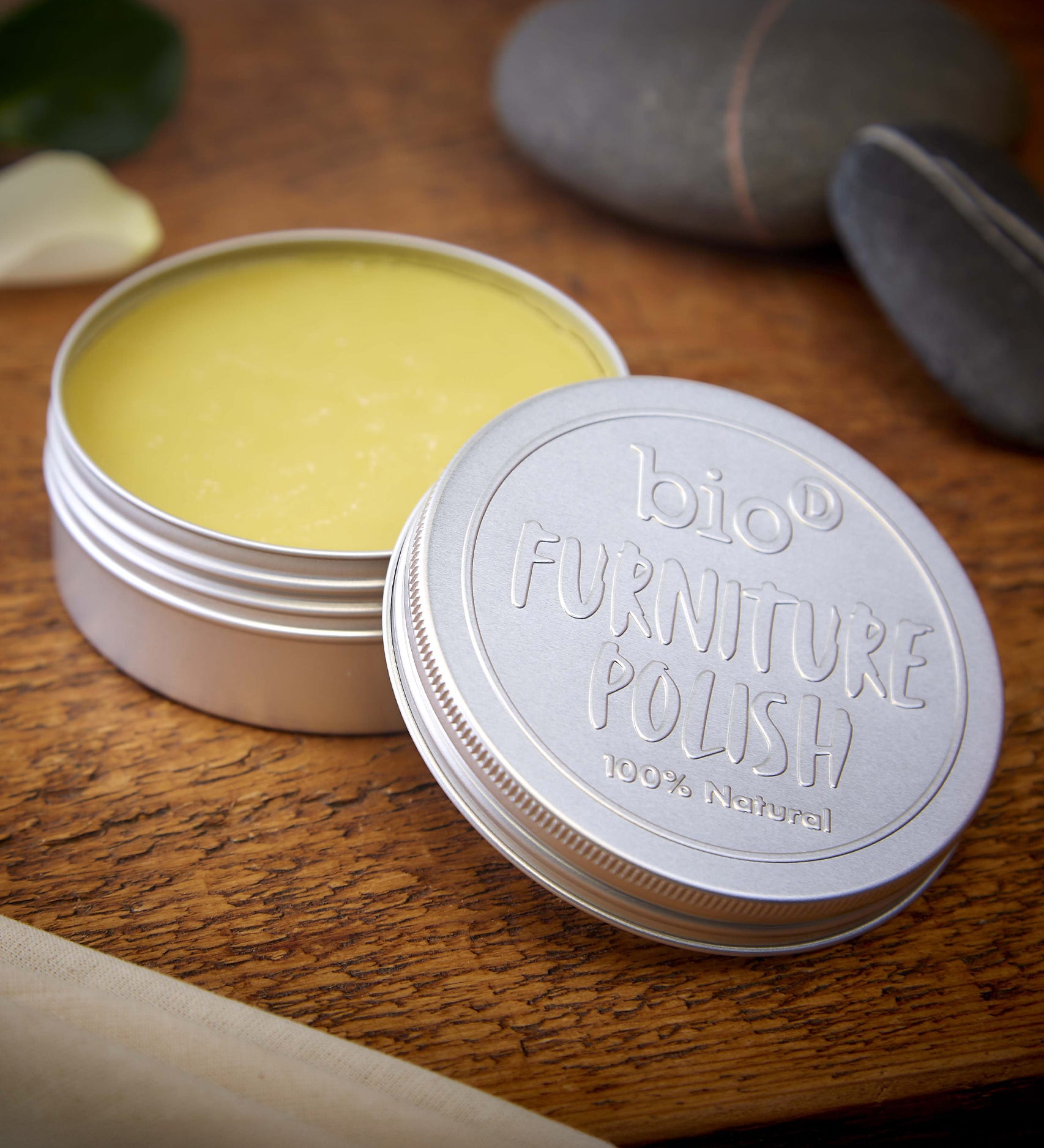 An open tin of Bio-D 100% natural furniture polish available at Babipur. showing the consistency of the polish