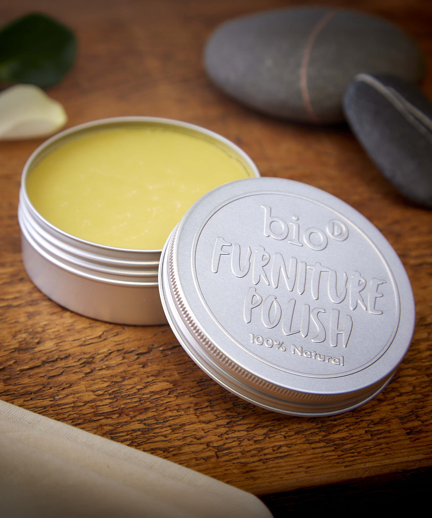 An open tin of Bio-D 100% natural furniture polish available at Babipur. showing the consistency of the polish