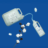 A 5L bottle of Bio-D cotton fresh non bio laundry liquid pouring into a 1L bottle. These two bottles are available at Babipur.