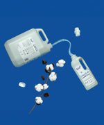 A 5L bottle of Bio-D cotton fresh non bio laundry liquid pouring into a 1L bottle. These two bottles are available at Babipur.