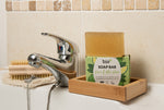 Bio-D natural Vegan aloe vera and lime soap bar next to a bathroom sink