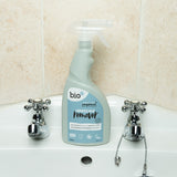 A bottle of Bio-D limescale remover standing on a bathroom sink. This limescale remover is available at Babipur. 