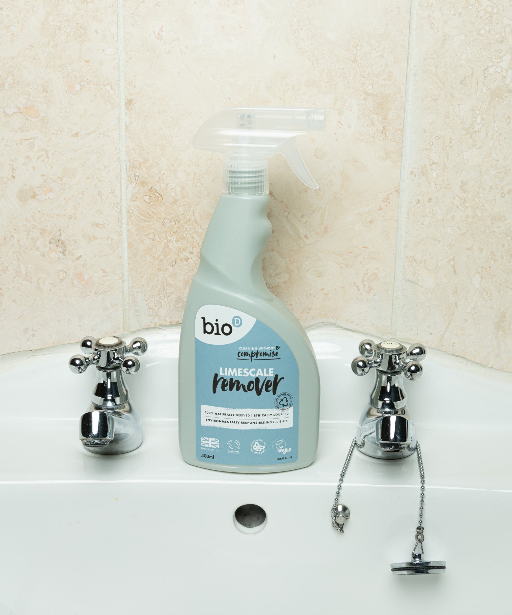 A bottle of Bio-D limescale remover standing on a bathroom sink. This limescale remover is available at Babipur. 