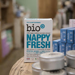 Bio-D box of nappy fresh powder 500g on a wooden table