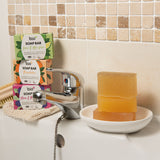 A stack of the 3 different Bio-D soap bars on a bathroom sink. These soap bars are available at Babipur