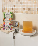 A stack of the 3 different Bio-D soap bars on a bathroom sink. These soap bars are available at Babipur