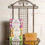 A stack of the 3 different Bio-D soap bars on a fancy metal holder stuck on a wall. These soap bars are available at Babipur