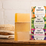 Bio-D natural Vegan mandarin soap bar on a light orange background
