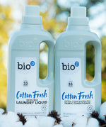 A 1L bottle of Bio-D cotton fresh laundry liquid and fabric conditioner standing on a pile of cotton.