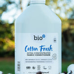A 5L bottle of Bio-D cotton fresh fabric conditioner standing on a pile of cotton.
