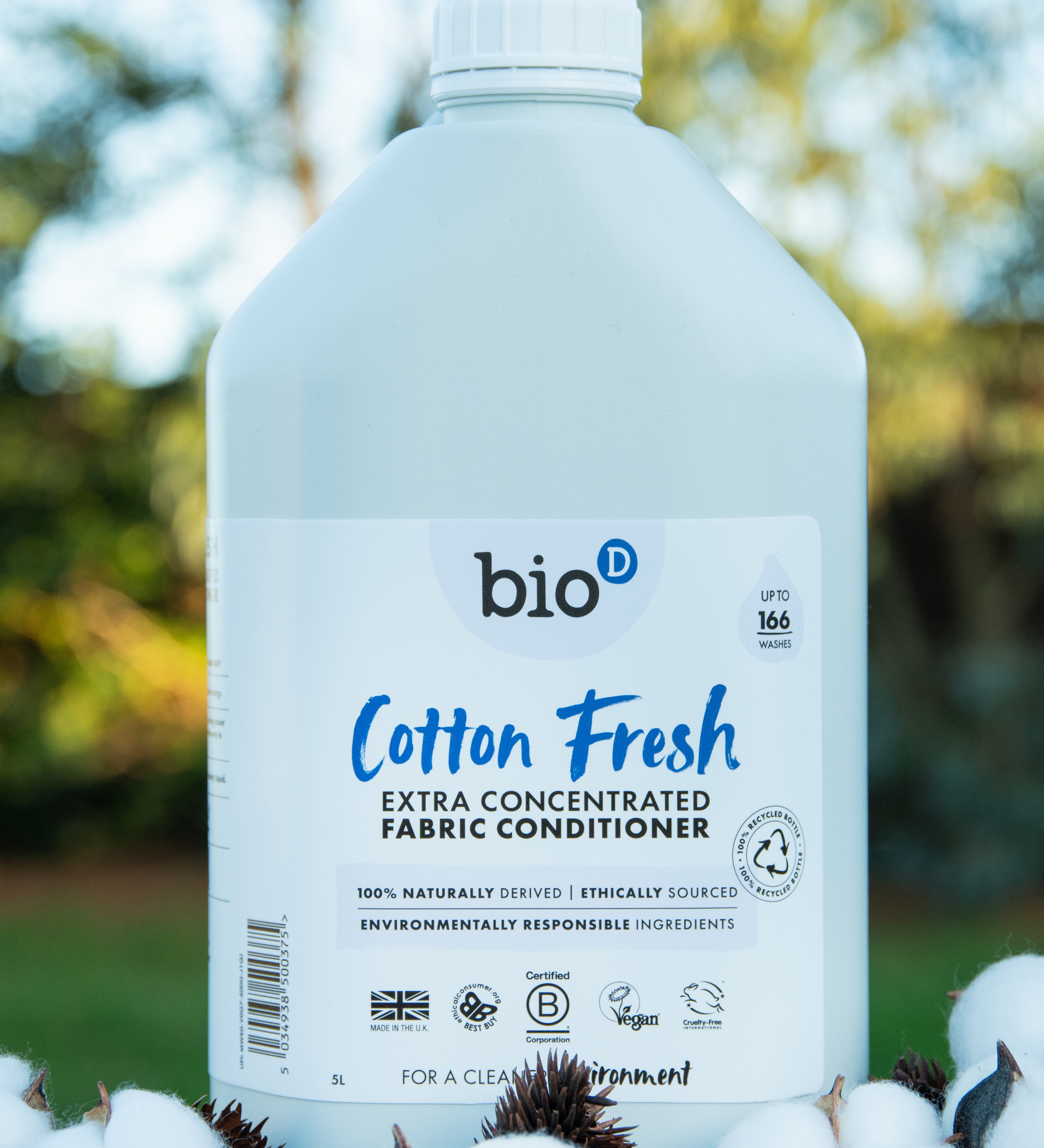 A 5L bottle of Bio-D cotton fresh fabric conditioner standing on a pile of cotton.
