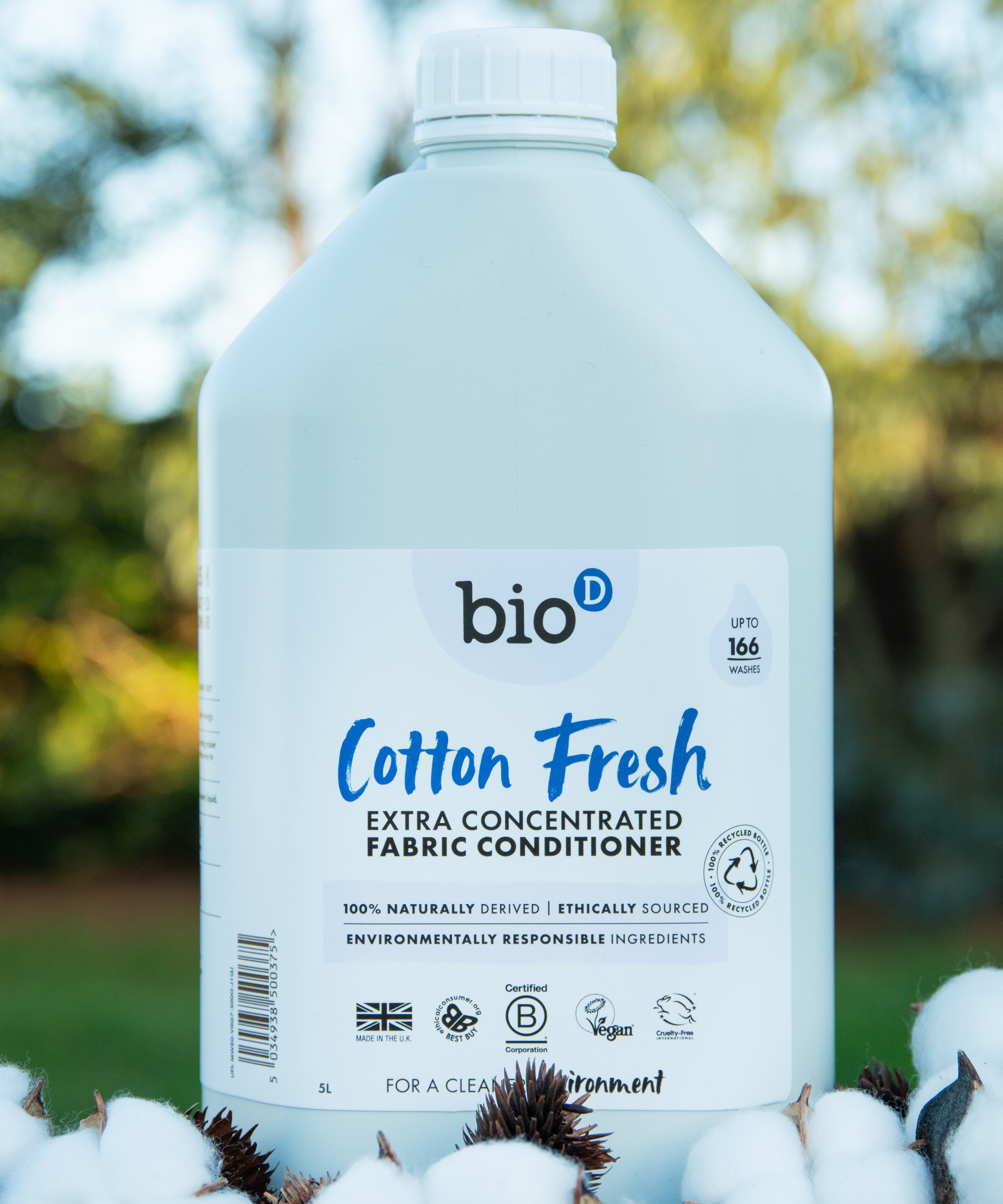 A 5L bottle of Bio-D cotton fresh fabric conditioner standing on a pile of cotton.